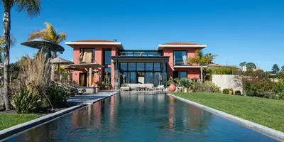 a house with a swimming pool in front of a house at Contemporary Villa With Views Of Cap D'antibes in Nice