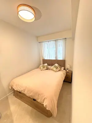 a bedroom with a bed and a window at Appartement Nice Magnan promenade in Nice