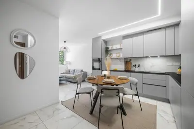 a kitchen and dining room with a table and chairs at Nice - Mordern Apartment Sea Close in Nice