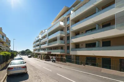 a car parked in front of a building at Appartement Amandiers - Welkeys in Cagnes-sur-Mer