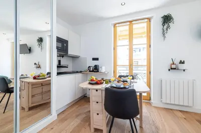a kitchen with a table and a dining room at MY CASA - BUFFA 3-53 - Superb Studio Suite City Center in Nice