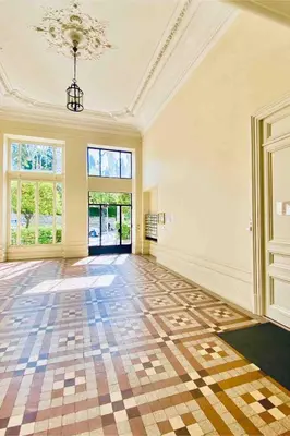 an empty room with a checkered floor and windows at Nice - Little Studio with Sunny Terrace in Nice