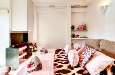 a bedroom with a bed with pillows on it at Nice - Little Studio with Sunny Terrace in Nice