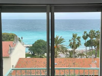a view of the beach from a window at STUDIO EN FACE DE LA PLAGE AVEC une VUE FANTASTIQUE ! in Nice