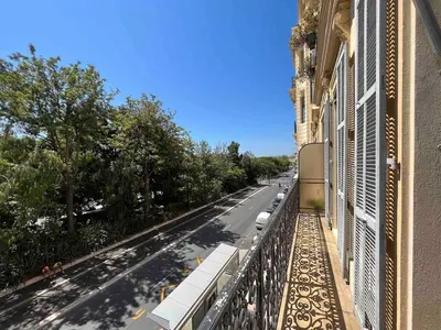 a view of a street from a balcony of a building at Beautiful studio with parking place Massena in Nice
