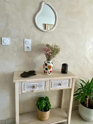 a small bedroom with a bed and a table at Appartement 2P Cros de Cagnes à 2 pas de la mer in Cagnes-sur-Mer