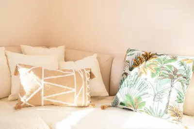 a pile of pillows on a couch with a pillow at #25 2BDR Port, 5min from the Old Town Balcony, AC&WIFI in Nice