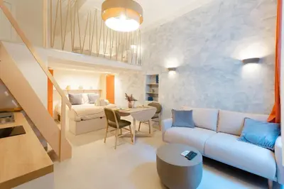 a living room with a couch and a table at New- Cozy apartment -4 guests - Air conditioning in Nice
