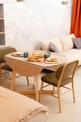 a coffee table with food on it in a living room at New- Cozy apartment -4 guests - Air conditioning in Nice