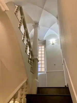 a staircase in a building with a window at New- Cozy apartment -4 guests - Air conditioning in Nice