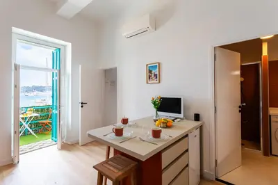 a room with a desk with a computer and a window at TERRACOTTA AP4457 By Riviera Holiday Homes in Villefranche-sur-Mer
