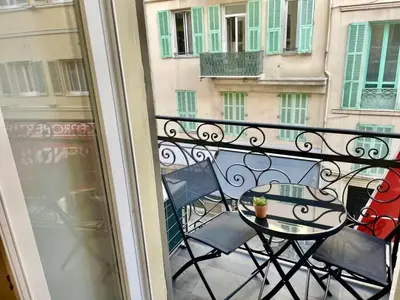 a view of a balcony with a table and chairs at Suite Massena in Nice