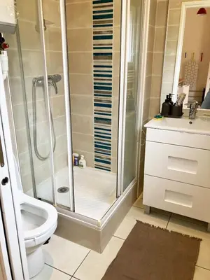 a blue bed sitting in a room at Studio balcon proche mer in Nice