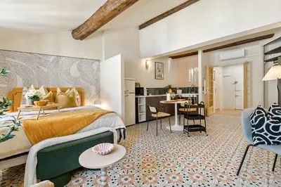 a hotel room with a bed and a kitchen at Nice Renting - CENTRALE - Authentic Loft Old Nice Rooftop View & Charm in Nice