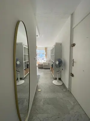 a mirror on a wall in a room at apppartement avec terrasse - 2 à 4 personnes in Nice