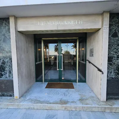 an entrance to a building with a revolving door at Vue mer studio tout équipé in Nice