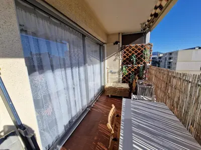 a balcony with a large window on a building at Chez Stella - Proche Mer in Nice