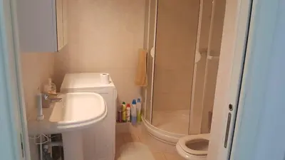 a bathroom with a shower and a sink and a toilet at Entire Condo in Nice in Nice