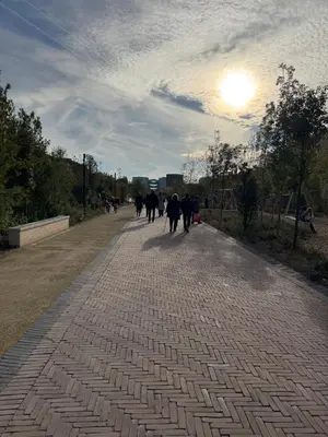 a group of people walking down a brick road at Beau Studio avec belle terrasse au centre ville de Nice in Nice