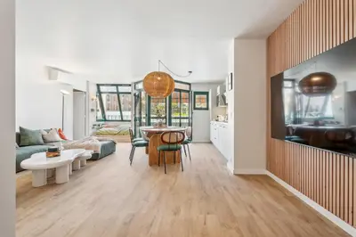 a kitchen and living room with a table and chairs at Nice Renting - FLEURS - Luxury Stay Terrace Quiet Private Parking in Nice