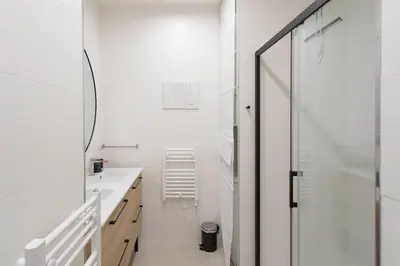 a bathroom with a glass shower and a sink at #35 Suite Carlone 5min from the beach AC & Terrace in Nice