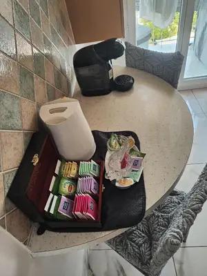 a table with a trash can on top of it at Spacieux 3 chambres et balcon in Nice