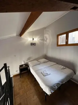 a bedroom with a white bed in a room at Central Super Loft in Nice