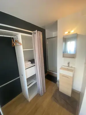 a small bathroom with a sink and a mirror at Appartement de 4 chambres proche plage, tram et aeroport in Nice