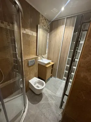 a bathroom with a toilet and a sink and a shower at Appartement Jardin 10mn centre in Nice