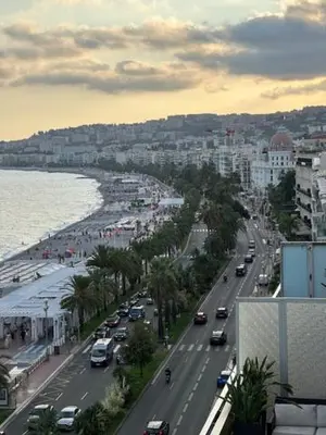 a view of a city with cars driving down a street at Studio et ses deux piscines in Nice