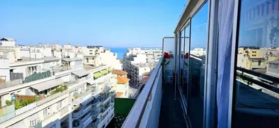 a view of a city from the balcony of a building at Top Floor with Sea View, Clim and Veranda in Nice