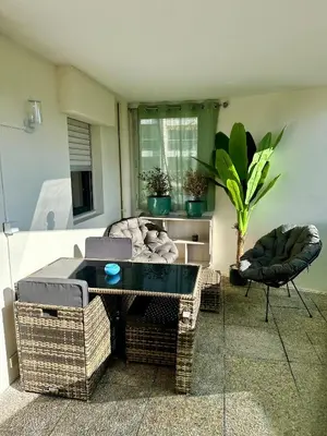a living room with a couch and a table at Appartement Zephyr - à 1 minute de la plage in Cagnes-sur-Mer