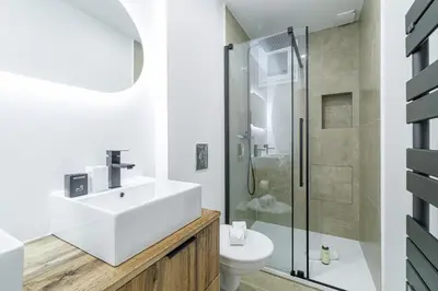 a white bathroom with a sink and a shower at Large & Confort 2 Bdr Renovated in Nice