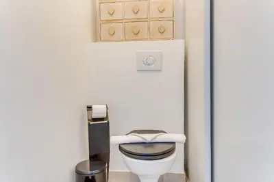 a bathroom with a toilet in a room at LE PAIROLIERE AP4461 by Riviera Holiday Homes in Nice