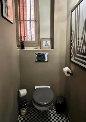 a small bathroom with a toilet and a window at Berlioz Blue AP4458 by Riviera Holiday Homes in Nice