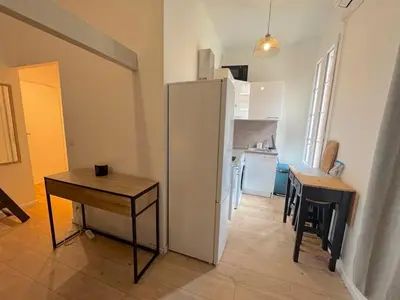 a table and two chairs on a balcony at ⁂Appartement élégant plage à 100m prom des anglais in Nice