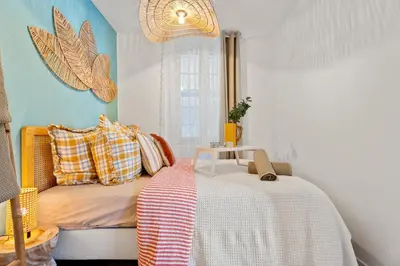 a room with a bed and a table in it at Nice Renting - CLEMENCEAU - Riviera Cocoon Calm Elegance Design in Nice