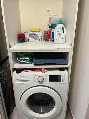 a white washer and dryer in a room at 3 pièces central au pied de la promenade du paillon in Nice