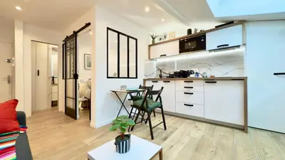 a kitchen and living room with a table and chairs at Ze Perfect Place - Magnifique Studio Vieux Nice in Nice