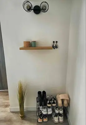 a room with a shelf with a bunch of shoes at Nice centre studio rénové avec emplacement central in Nice