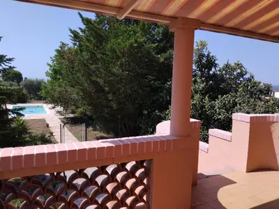 a view from the balcony of a house with a pool at Beautiful Villa with large pool and garden 20 mn from Nice in Colomars