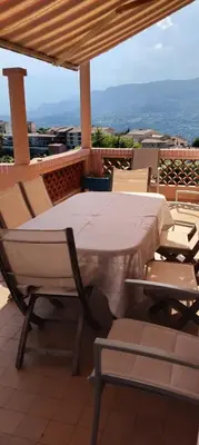a table and chairs on top of a roof at Beautiful Villa with large pool and garden 20 mn from Nice in Colomars