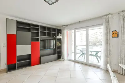 a living room with a red and black wall at Charming stay in Nice in Nice