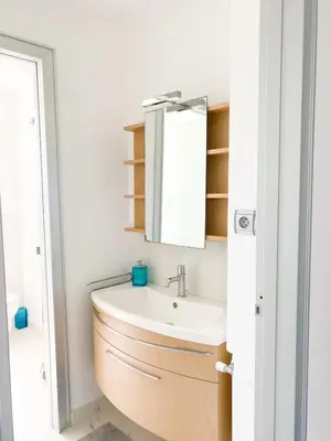 a bathroom with a sink and a mirror at Appartamento vista mare in Saint-Jean-Cap-Ferrat