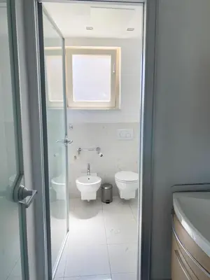 a bathroom with a toilet and a sink at Appartamento vista mare in Saint-Jean-Cap-Ferrat
