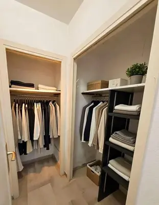 a walk in closet filled with lots of clothes at Studio Premium au Calme avec Terrasse Vue Mer et Parking in Nice