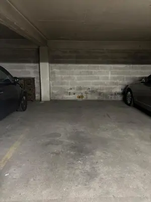 a garage with two cars parked in it at NICE, Exceptional Sea View, Top Floor, Parking in Nice
