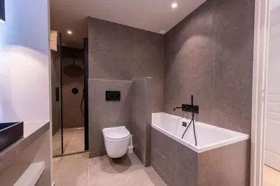 a bathroom with a toilet and a bath tub at Sublime villa d'architecte, piscine et parking in Nice