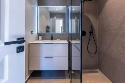 a bathroom with a sink and a shower at Sublime villa d'architecte, piscine et parking in Nice