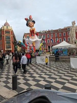 a group of people walking around in a city with a largeilyn at Wonderful apartment and garden heart of Nice in Nice